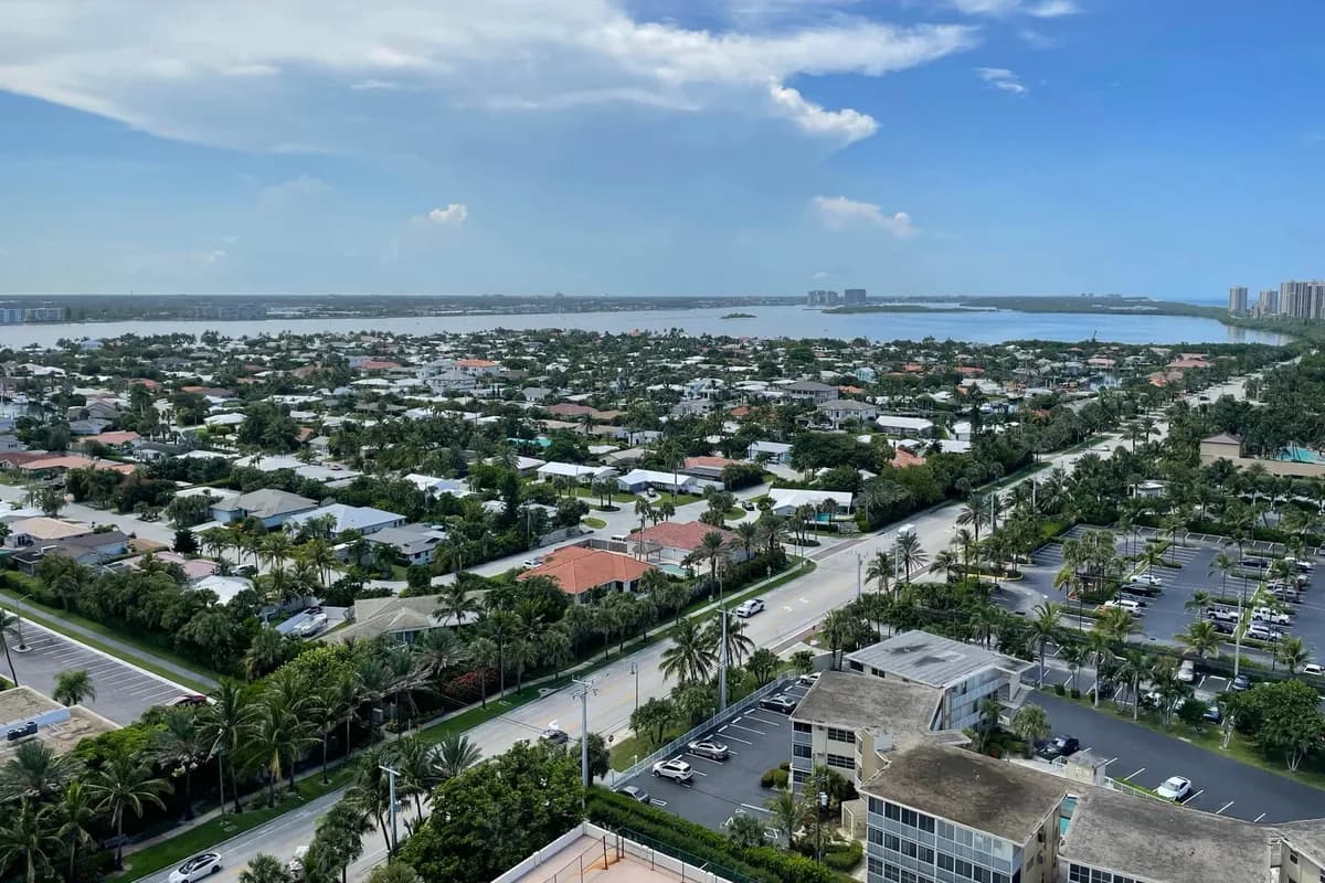 Streets of single-family homes on Singer Island seen from a high-rise, with the Lake Worth Lagoon beyond