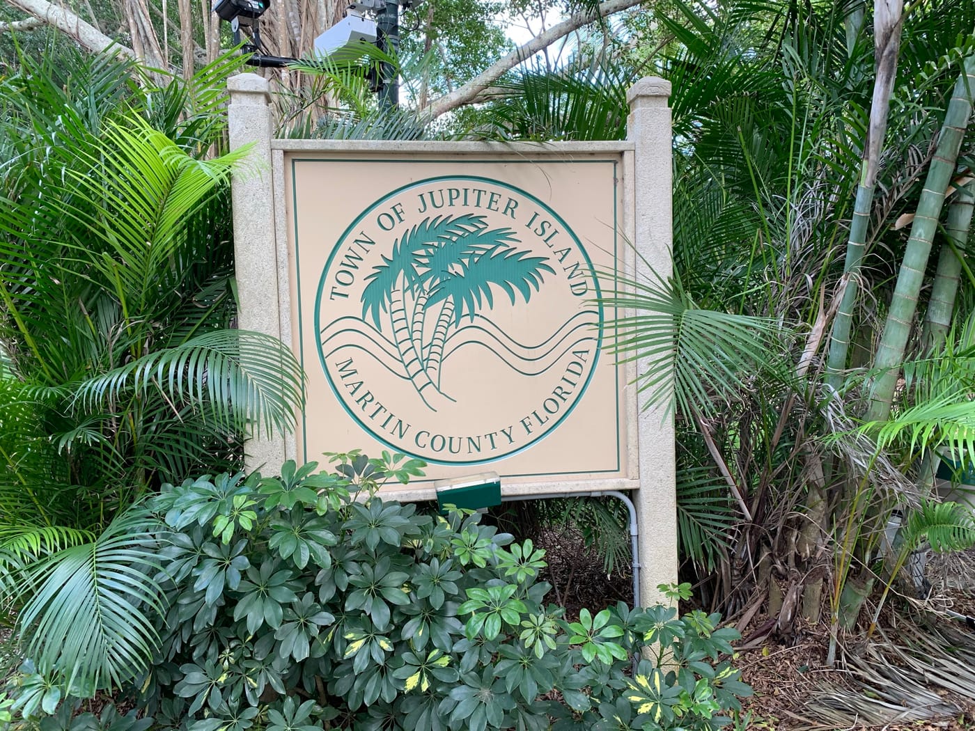 The Town of Jupiter Island, Martin County, Florida sign among tropical plants