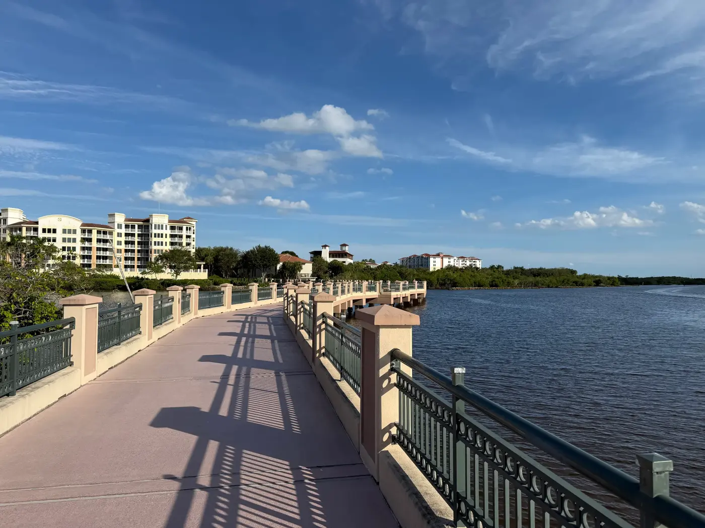 The Jupiter Riverwalk boardwalk over the Intracoastal Waterway, with condominium buildings along the shore