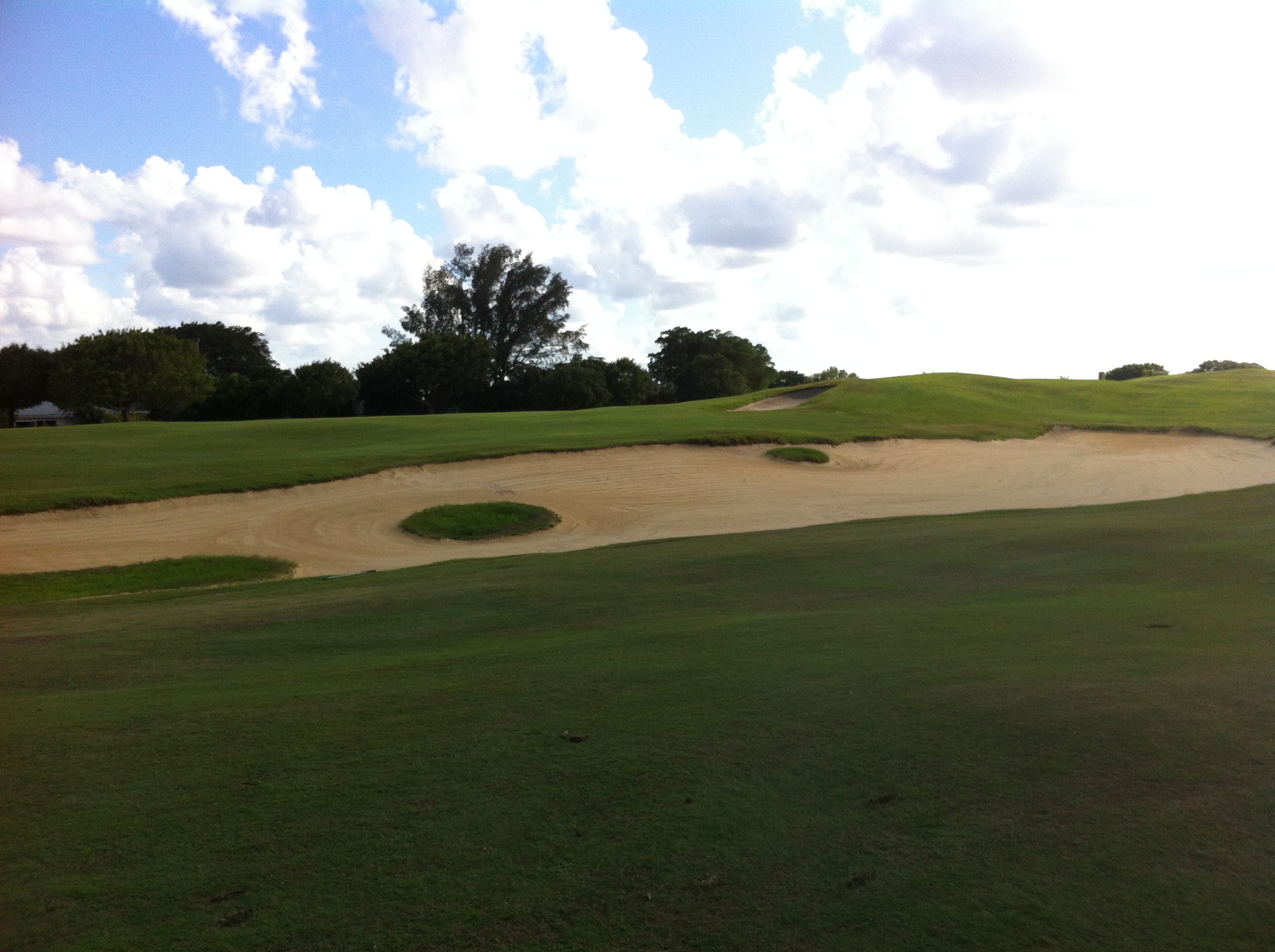 Golf fairway with sculpted bunkering in Palm Beach Gardens