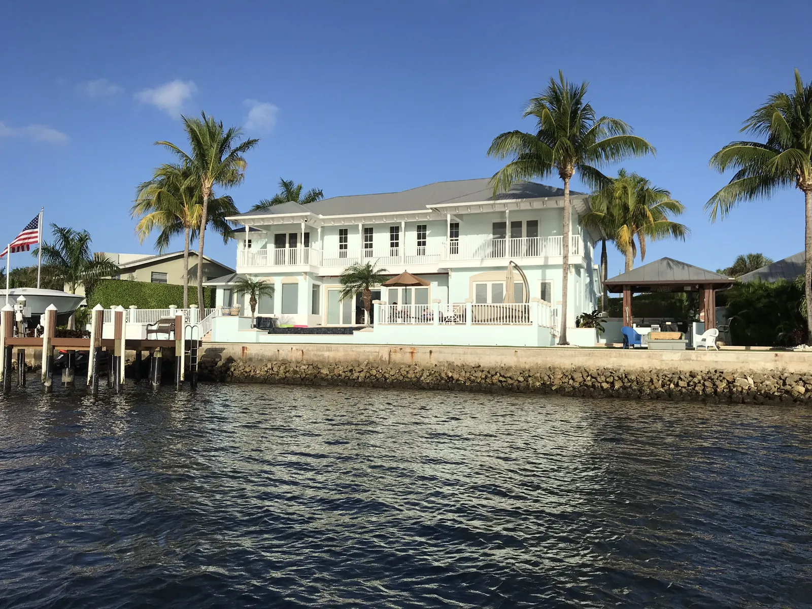 Waterfront two-story British West Indies-style estate with private dock and cabana