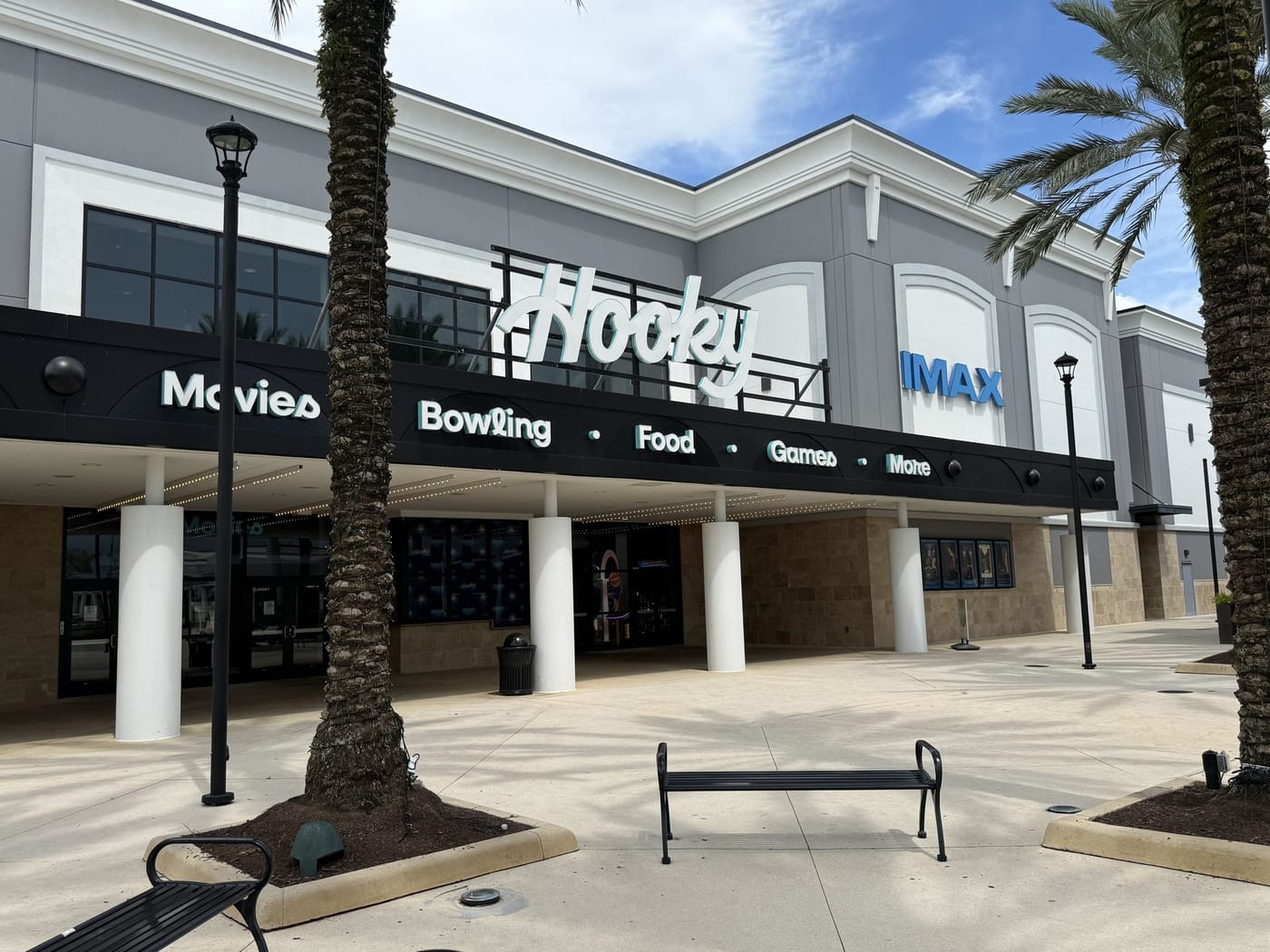 The Hooky entertainment building at Delray Marketplace, with a marquee reading Movies, Bowling, Food, Games, More and an IMAX sign